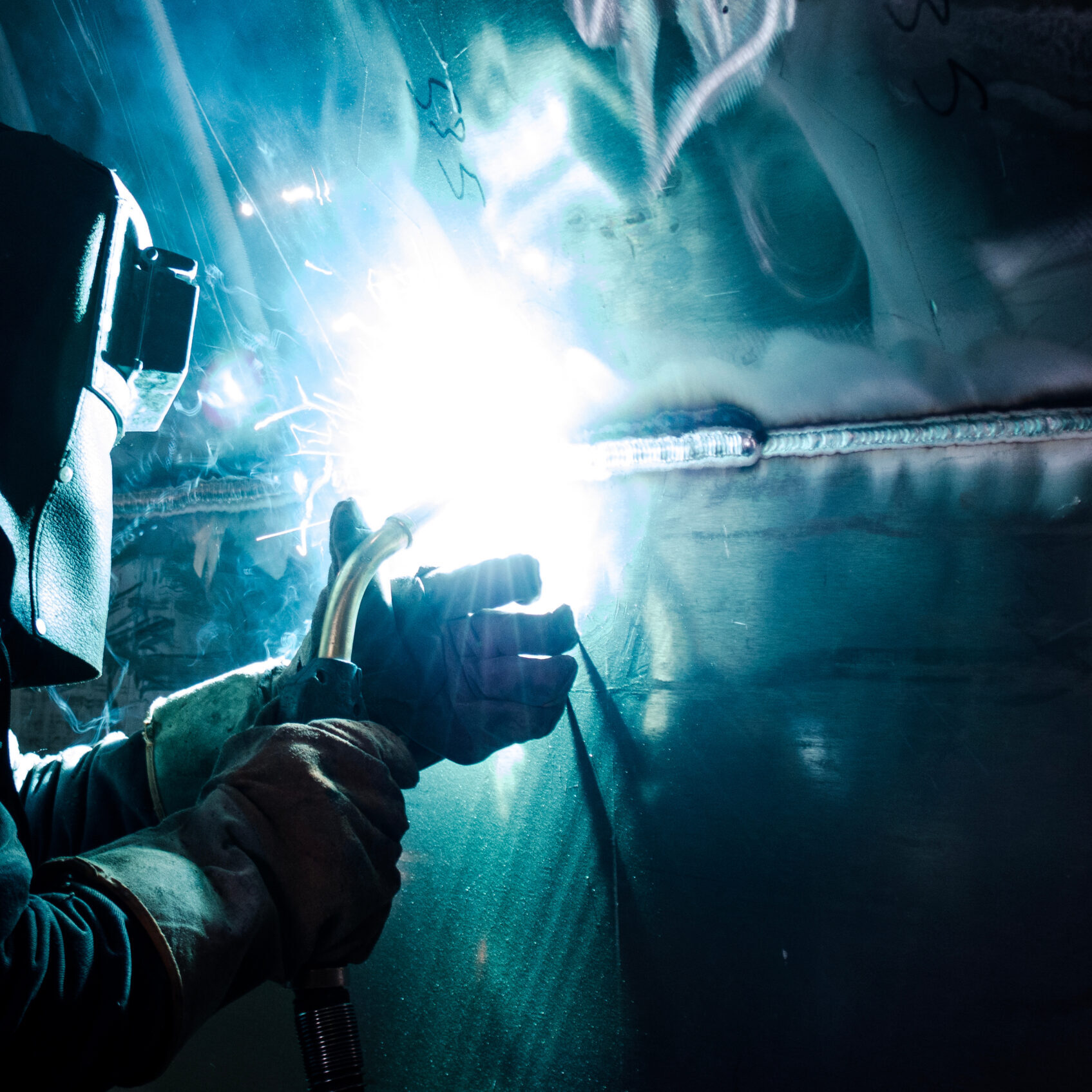 welder at work with aluminum welding