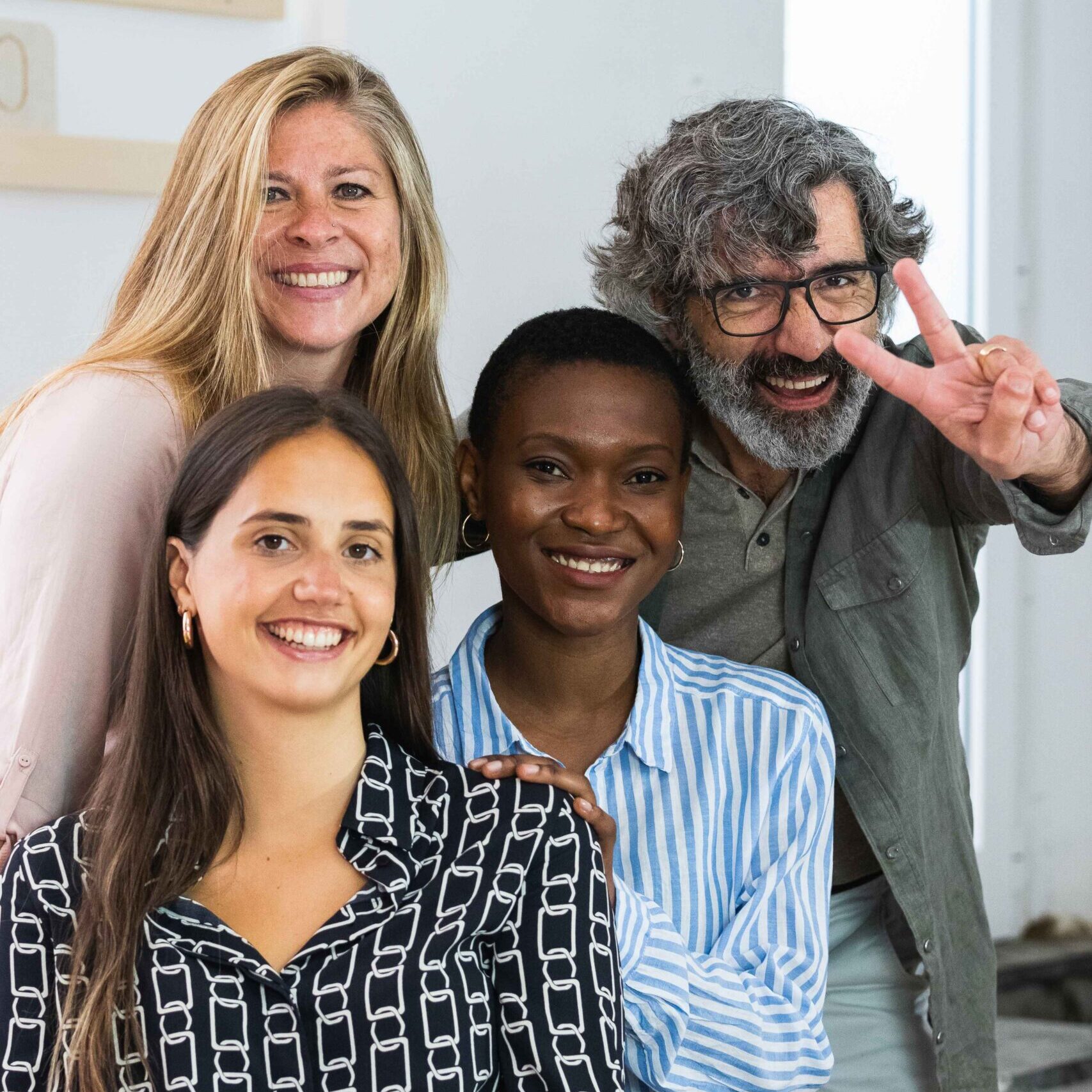 cheerful-diverse-coworking-women-looking-at-camera-2024-05-11-01-38-17-utc_11zon